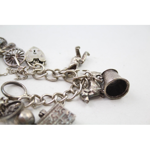 197 - Silver charm bracelet including animal charms (54g)