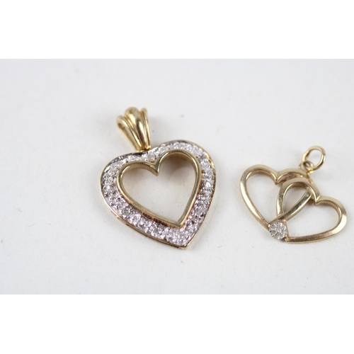 120 - 2x 9ct gold diamond heart pendants (2.4g)