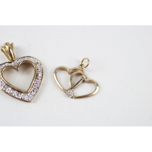 120 - 2x 9ct gold diamond heart pendants (2.4g)