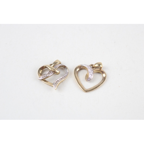 121 - 2x 9ct gold diamond heart pendants (2g)