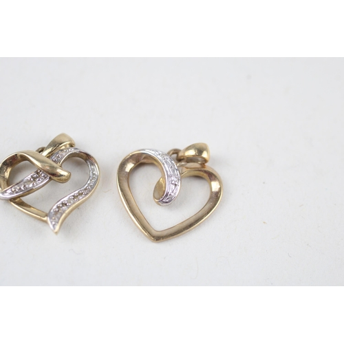 121 - 2x 9ct gold diamond heart pendants (2g)