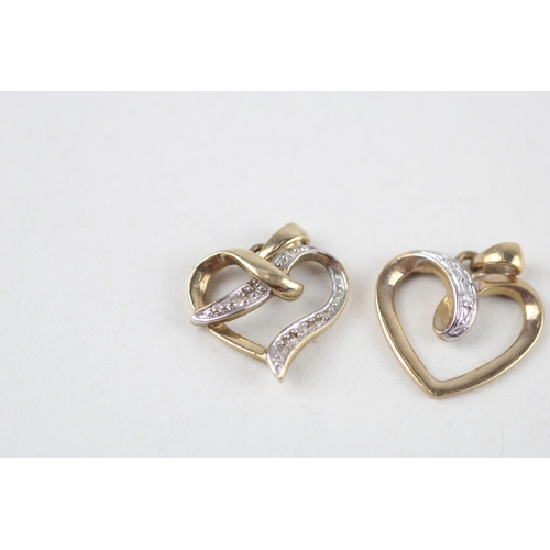 121 - 2x 9ct gold diamond heart pendants (2g)