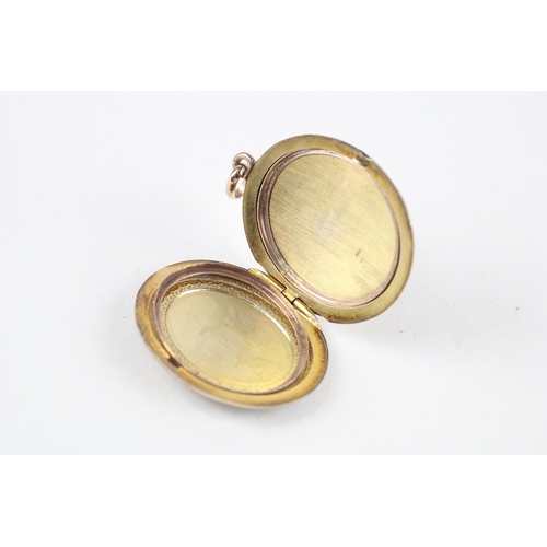 74 - 9ct gold patterned locket (12.1g)