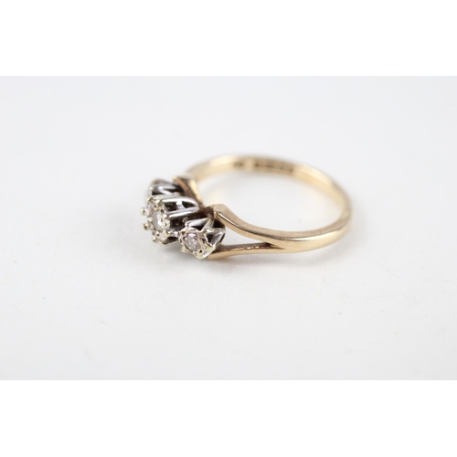 83 - 9ct gold diamond three stone ring (2.6g) Size  M