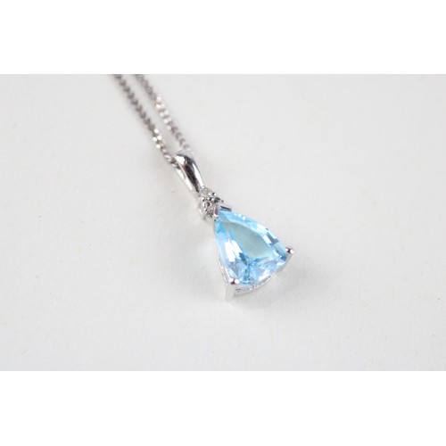 106 - 9ct gold aquamarine & diamond pendant & chain (2.1g)