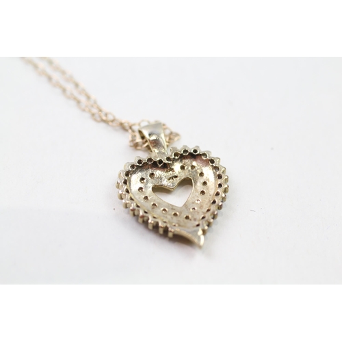 29 - 9ct gold diamond heart shaped pendant & chain (4.1g)