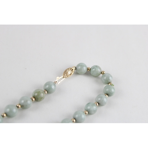 64 - 14ct gold jade bead necklace (42.4g)