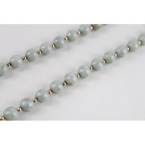 64 - 14ct gold jade bead necklace (42.4g)