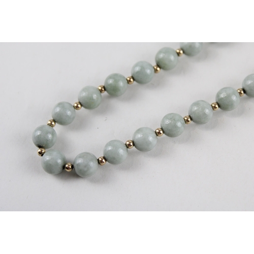 64 - 14ct gold jade bead necklace (42.4g)