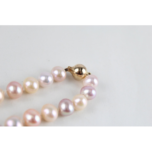 66 - 9ct gold cultured pearl necklace (55.3g)