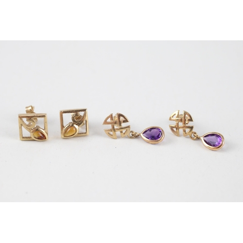 114 - 2x 9ct gold citrine & amethyst celtic earrings (2.8g)