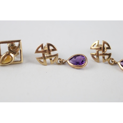 114 - 2x 9ct gold citrine & amethyst celtic earrings (2.8g)