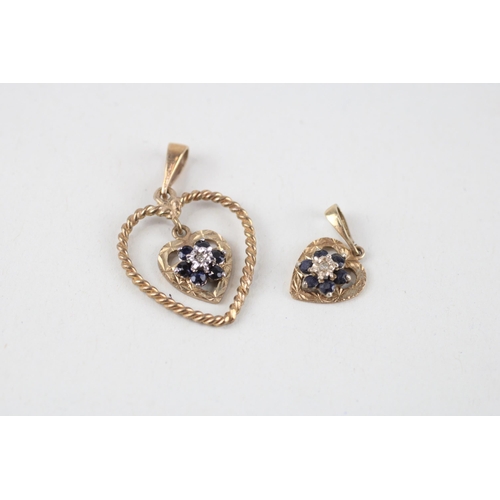 119 - 2x 9ct gold sapphire & diamond pendants (2.8g)