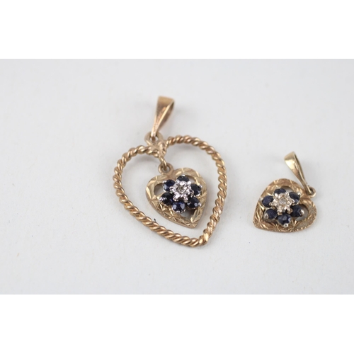 119 - 2x 9ct gold sapphire & diamond pendants (2.8g)