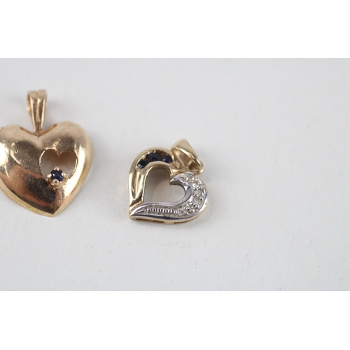 121 - 2x 9ct gold sapphire & diamond heart pendants (2g)