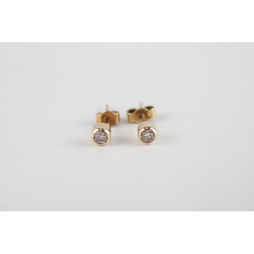 123 - 9ct gold diamond stud earrings (0.7g)