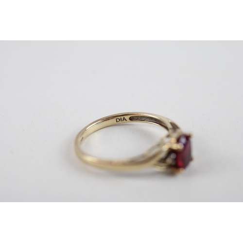 126 - 9ct gold red gemstone & diamond ring (1.8g) Size  M