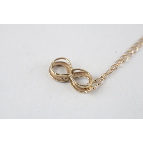 131 - 9ct gold diamond infinity pendant & chain (2.1g)