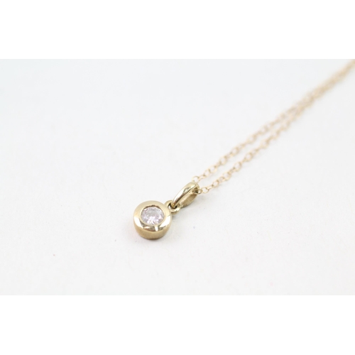 15 - 9ct gold diamond solitaire pendant & chain (1g)