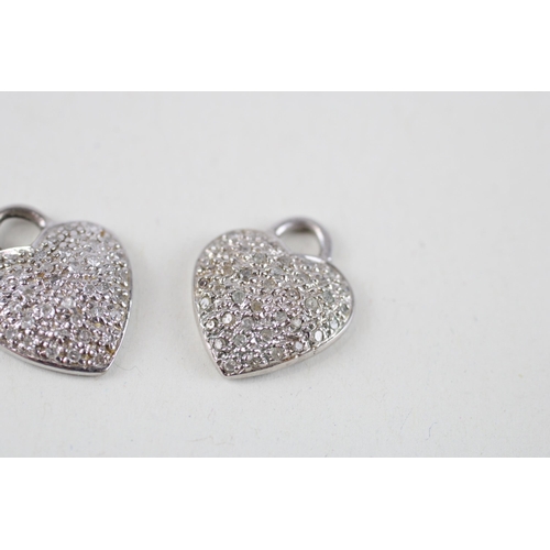 74 - 2x 9ct white gold diamond heart shaped pendants (4g)