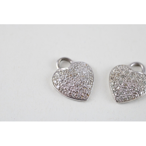 74 - 2x 9ct white gold diamond heart shaped pendants (4g)