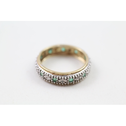 93 - 9ct gold emerald & diamond full eternity ring (2.6g) Size  N