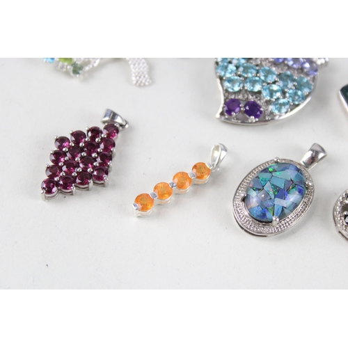 156 - A collection of silver gemstone pendants including Opal (46g)