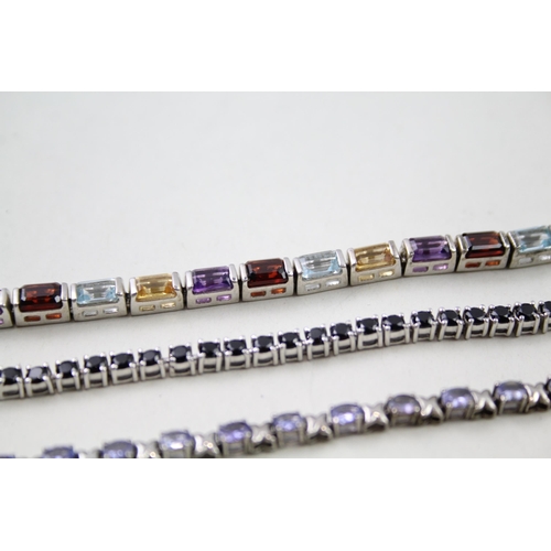 157 - Three silver gemstone tennis bracelets including Garnet (31g)