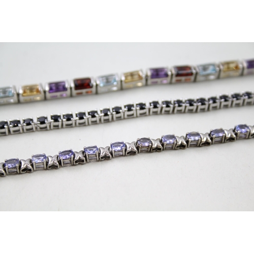 157 - Three silver gemstone tennis bracelets including Garnet (31g)