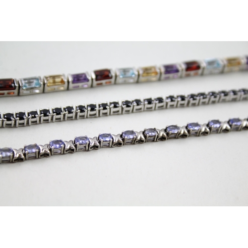 157 - Three silver gemstone tennis bracelets including Garnet (31g)