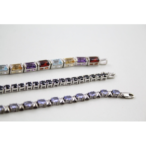 157 - Three silver gemstone tennis bracelets including Garnet (31g)