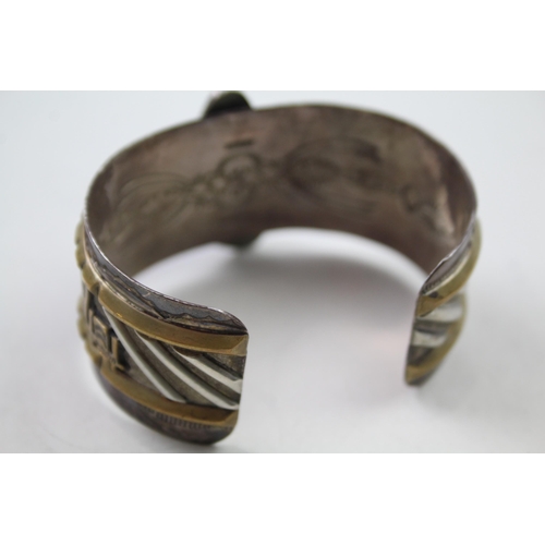 162 - Silver Navajo story telling bangle signed by Nellie Ramone (69g)