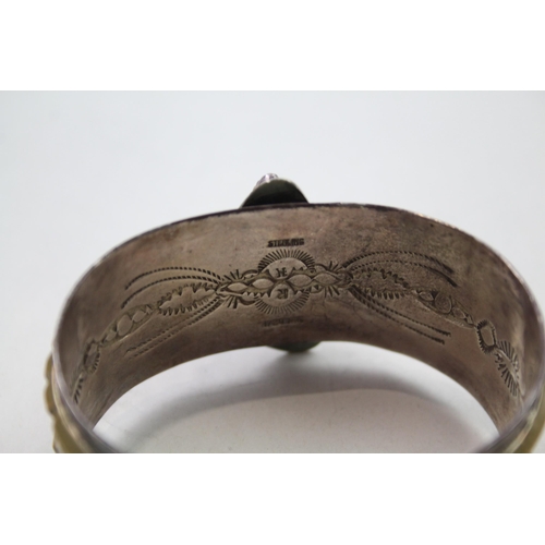 162 - Silver Navajo story telling bangle signed by Nellie Ramone (69g)