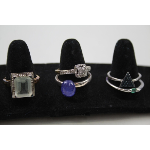 178 - A collection of silver gemstone rings including Emerald (24g)