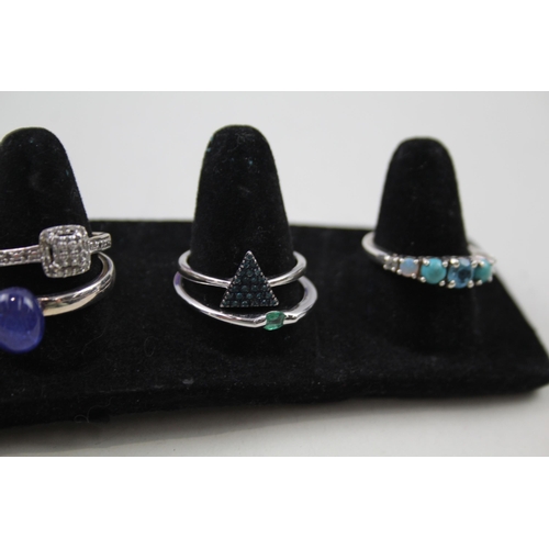 178 - A collection of silver gemstone rings including Emerald (24g)