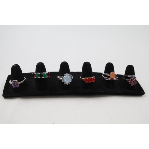 179 - A collection of silver gemstone rings including Amethyst (23g)