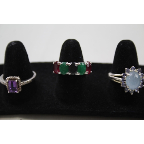 179 - A collection of silver gemstone rings including Amethyst (23g)