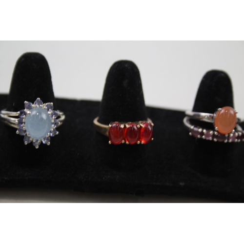 179 - A collection of silver gemstone rings including Amethyst (23g)