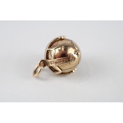 131 - 9ct gold masonic ball charm with millennial hallmark (8.7g)