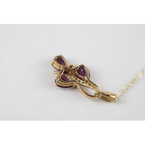 132 - 9ct gold purple gemstone & diamond pendant & chain (2.5g)