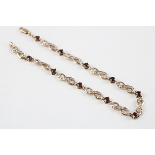 63 - 9ct gold garnet & diamond bracelet (5.8g)