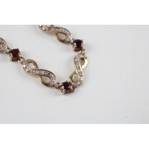 63 - 9ct gold garnet & diamond bracelet (5.8g)