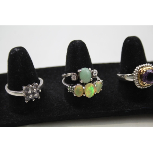 170 - A collection of silver gemstone rings including Garnet (29g)