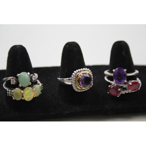 170 - A collection of silver gemstone rings including Garnet (29g)