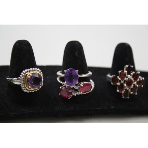 170 - A collection of silver gemstone rings including Garnet (29g)