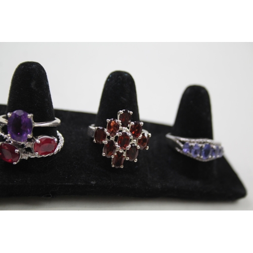 170 - A collection of silver gemstone rings including Garnet (29g)