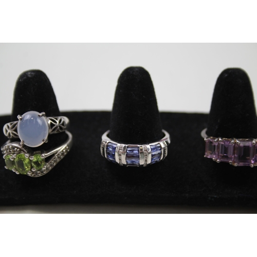 171 - A collection of silver gemstone rings including Tanzanite (30g)