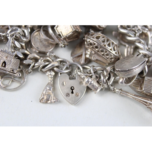 189 - Silver charm bracelet including Disney charm (106g)