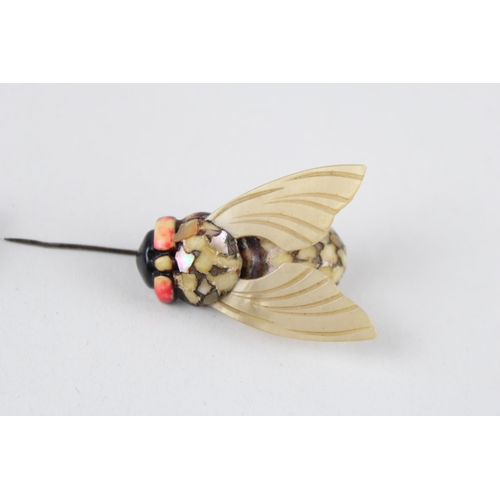 190 - Two early plastic bug brooches (8g)