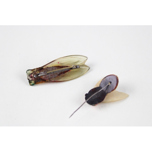 190 - Two early plastic bug brooches (8g)